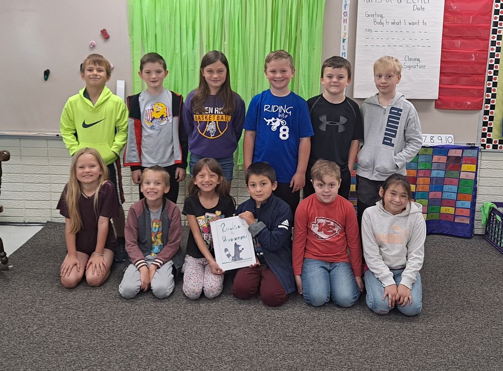 Second Graders with Rocket the Racoon Book