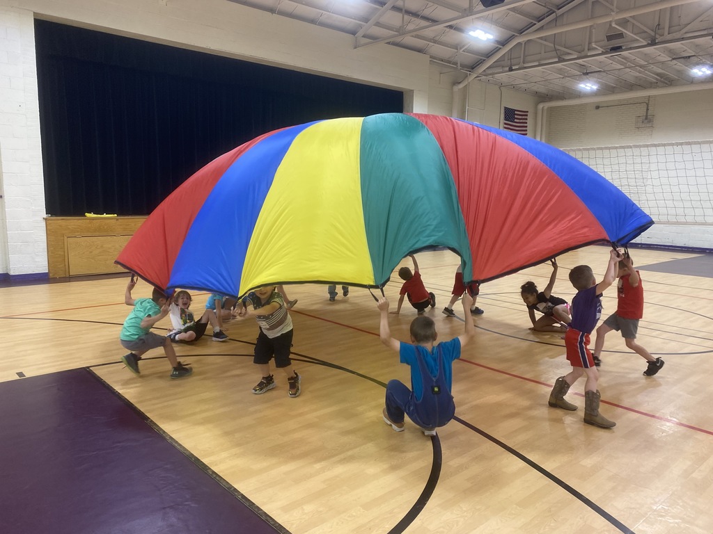 1st graders using the parachute