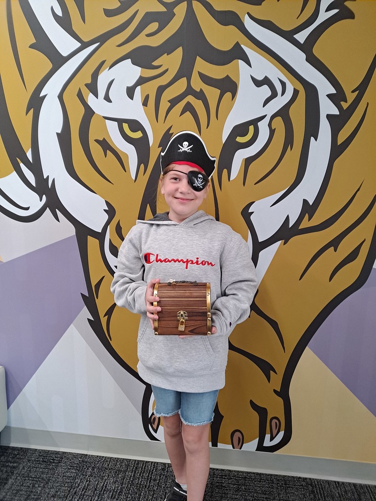 student holding treasure box